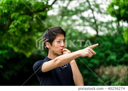 Man blowing whistle 40256274