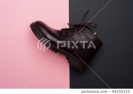 Dark brown man shoes on colorful background Dark brown man shoes on colorful background 40256310