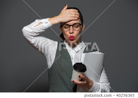 Cute businesswoman posing indoors Cute businesswoman posing indoors 40256365