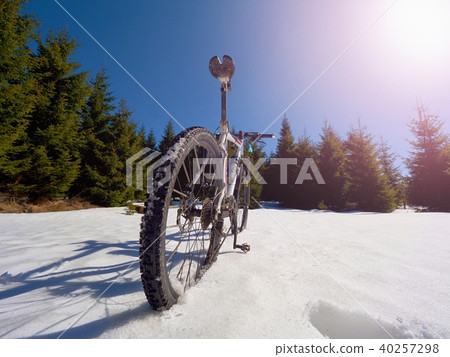 Mountain bike in deep snow. Winter mountains Mountain bike in deep snow. Winter mountains 40257298