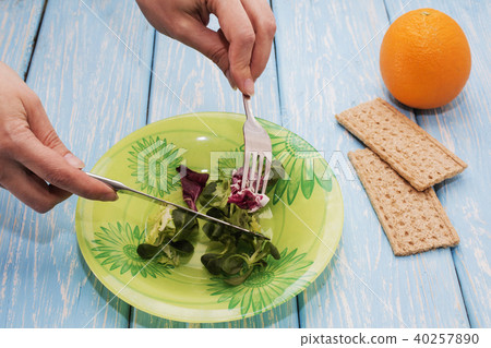 Delicious salad of green herbs on a plate. The concept of proper nutrition. Diet 40257890