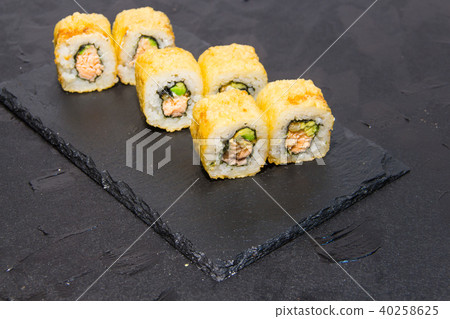 Hot Sushi roll with salmon. Japanese food. 40258625