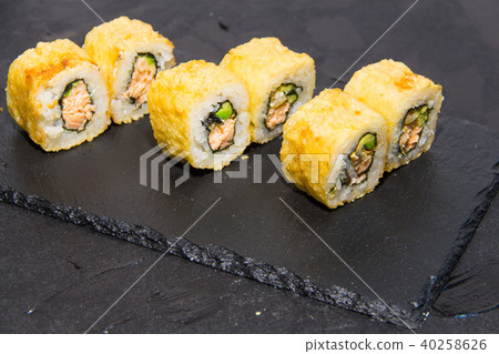 Hot Sushi roll with salmon. Japanese food. 40258626