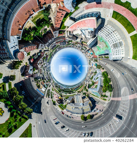 Aerial city view with crossroads and roads, houses, buildings, parks and parking lots. Sunny summer 40262284