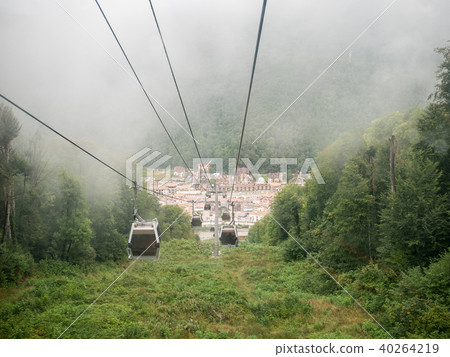 Picture of funicular in mountains against background of misty sky Picture of funicular in mountains against background of misty sky 40264219