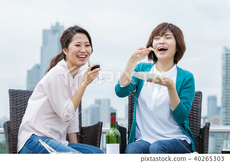Woman enjoying lunch on the terrace 40265303
