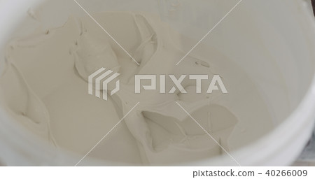 white putty ready to apply in a bucket 40266009