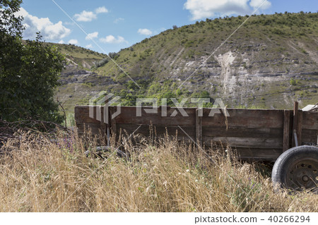Landscape with an old wagon. Landscape with an old wagon. 40266294