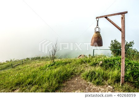 Mountain view with big bell at hill 40268059