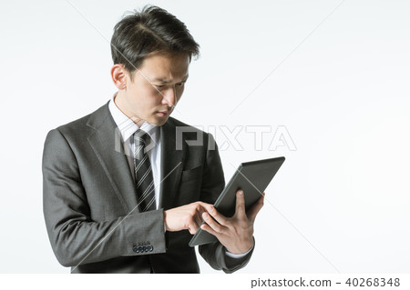 A businessman with a tablet A businessman with a tablet 40268348