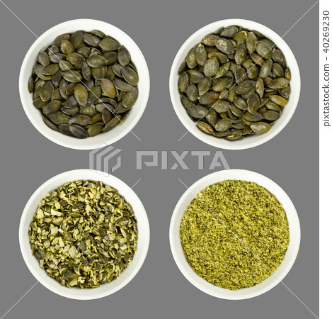 Pepita pumpkin seeds, raw, processed, in bowls Pepita pumpkin seeds, raw, processed, in bowls 40269230