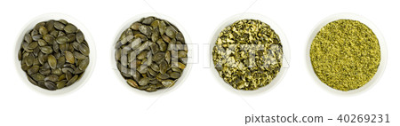 Pepita pumpkin seeds, raw, processed, in bowls Pepita pumpkin seeds, raw, processed, in bowls 40269231