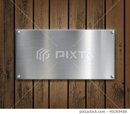 Metal plate on a wooden background. Metal plate on a wooden background. 40269486