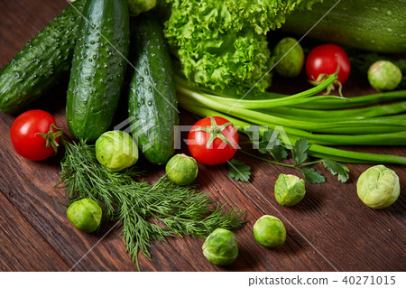 Fresh vegetables composition over wooden background, close-up, flat lay. Fresh vegetables composition over wooden background, close-up, flat lay. 40271015