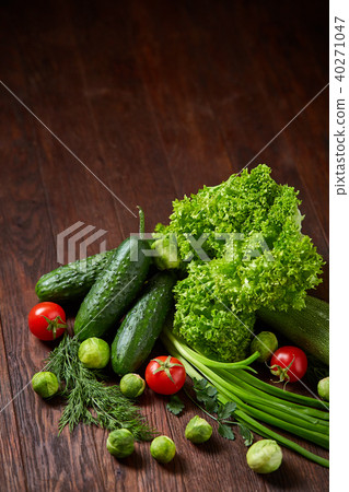 Fresh vegetables composition over wooden background, close-up, flat lay. 40271047