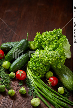 Fresh vegetables composition over wooden background, close-up, flat lay. 40271049