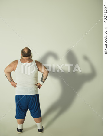 Fat man dreaming of fit muscular figure Fat man dreaming of fit muscular figure 40271554