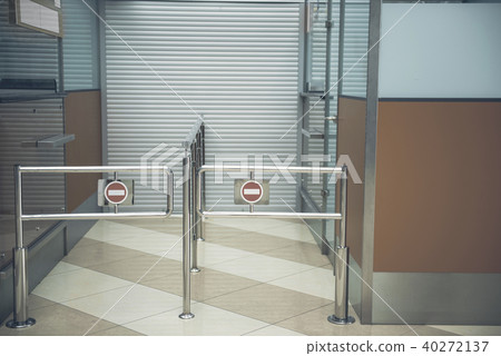 Silver metal structures opposite closed entrance Silver metal structures opposite closed entrance 40272137