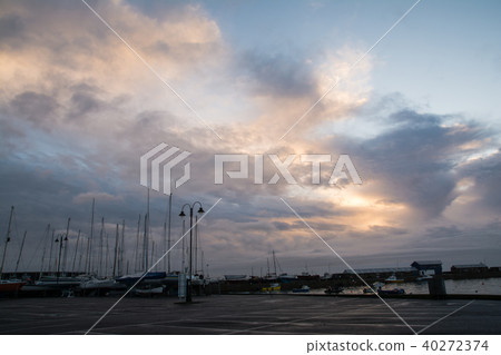 Yacht harbor under the morning sunburn Clouds and lots of yachts landed in the morning sun Yacht harbor under the morning sunburn Clouds and lots of yachts landed in the morning sun 40272374