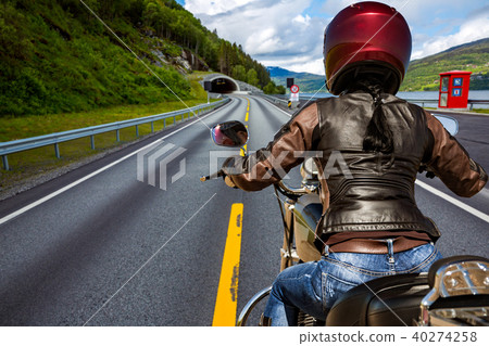 Biker girl First-person view, mountain serpentine. Biker girl First-person view, mountain serpentine. 40274258