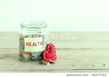 Coins in jar with Health label Coins in jar with Health label 40277425