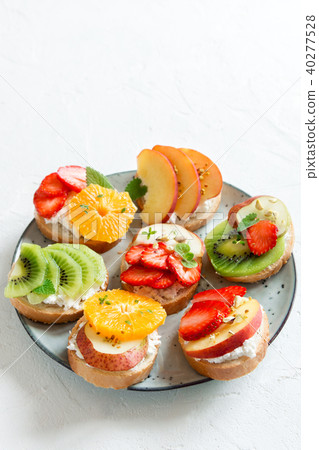 Fruit dessert sandwiches with ricotta cheese 40277528