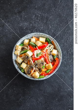 Stir fry with noodles, tofu and vegetables Stir fry with noodles, tofu and vegetables 40278620