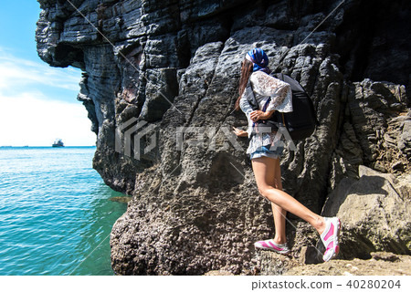 Travel people women tourist in a cave near Travel people women tourist in a cave near 40280204