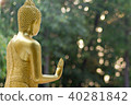 buddha statue standing, on blur background 40281842