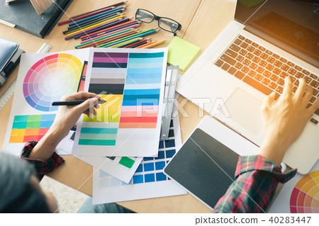 Top view of hand designer choosing colors 40283447