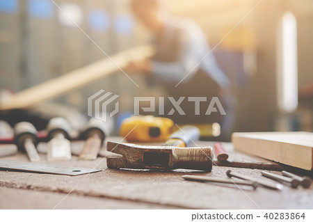 Carpenter working on woodworking machines Carpenter working on woodworking machines 40283864