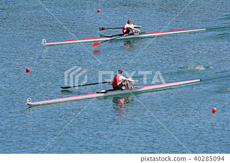 Rowers in a rowing boat on the race Rowers in a rowing boat on the race 40285094