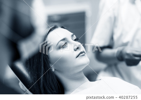 Young woman patient waiting treatment in stomatology clinic. Young woman patient waiting treatment in stomatology clinic. 40287255