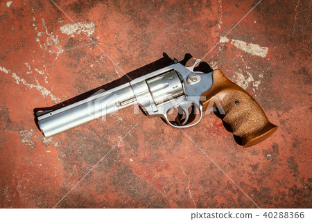 handgun on the concrete red backgroound handgun on the concrete red backgroound 40288366
