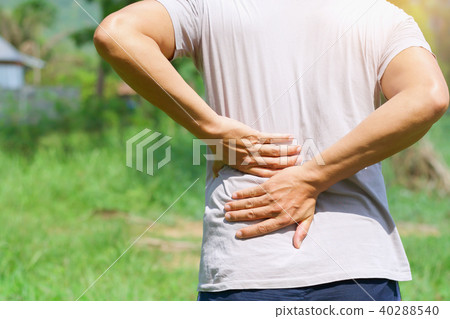 man runing with back pain at outdoor 40288540
