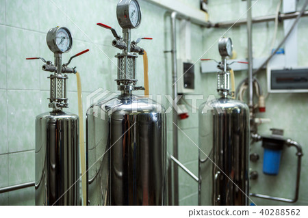 Copper still alembic inside distillery to distill grapes and produce spirits 40288562