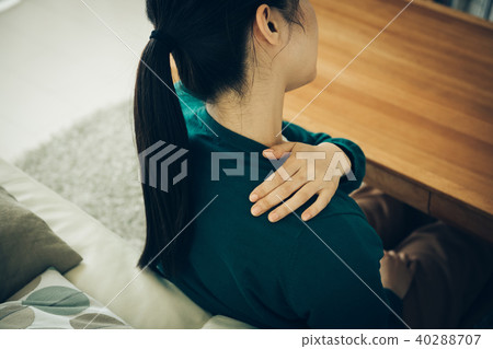 Young Japanese woman with stiff shoulders Young Japanese woman with stiff shoulders 40288707