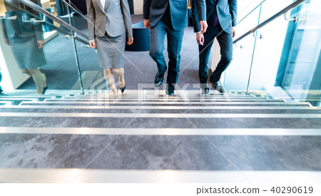 A businessman going up the stairs 40290619