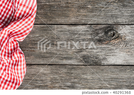 Red plaid kitchen textile on old wooden background 40291368