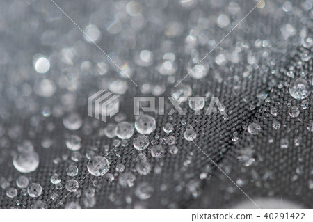 Closeup detailed view of raindrops on a fabric, a background. 40291422