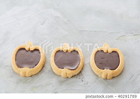Apple shaped biscuits arranged in rows on light textured background, close-up, shallow depth of Apple shaped biscuits arranged in rows on light textured background, close-up, shallow depth of 40291789