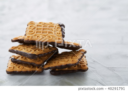 Square biscuits arranged in pattern on light textured background, close-up, shallow depth of field 40291791