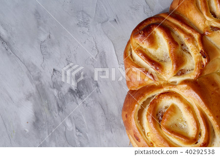 Homemade rose bread on white textured background, close-up, shallow depth of field, top view 40292538