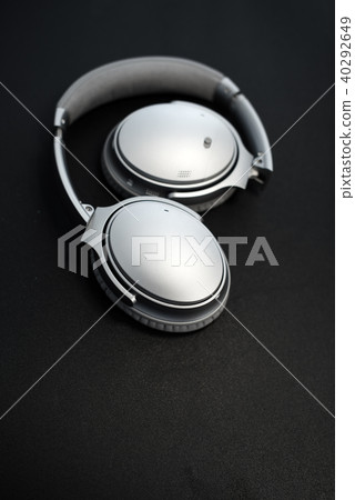 Sound music headphones. Stereo volume equipment object. Headphones on black background and copyspace 40292649