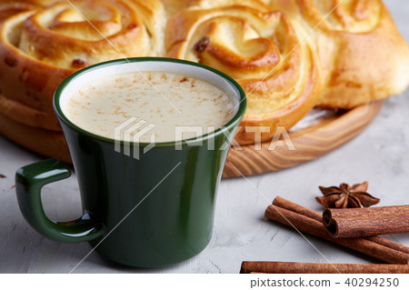 Homemade rose bread, cup of coffee, anise and cinnamon on white textured background, close-up 40294250