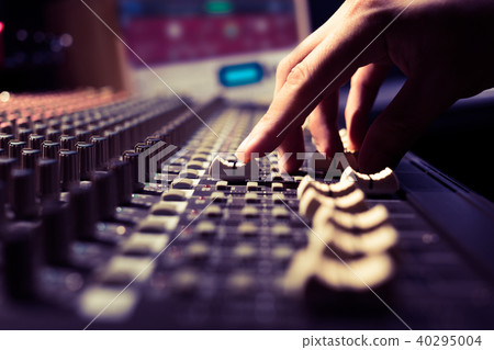 male sound engineer hands working on sound mixer male sound engineer hands working on sound mixer 40295004