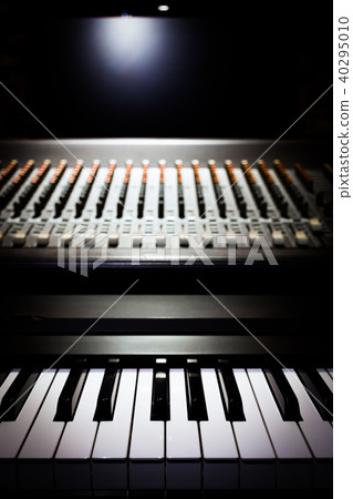 piano and sound mixer in recording studio 40295010