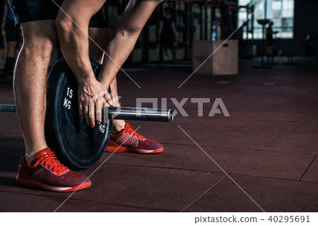 Young athlete getting ready for weight lifting training 40295691