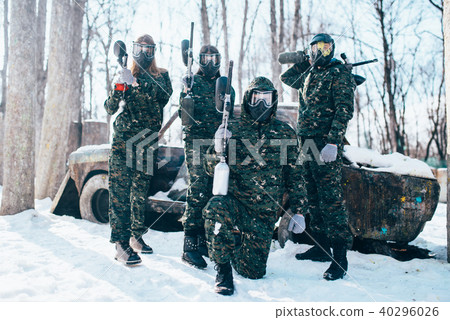 Paintball team poses with marker guns Paintball team poses with marker guns 40296026