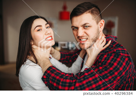 Husband and wife yelling at each other, quarrel 40296384